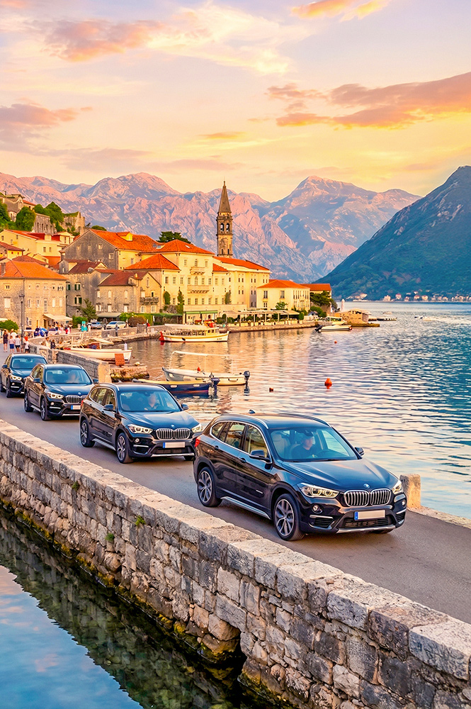Luxury SUVs driving along the scenic Adriatic coastline in Croatia.