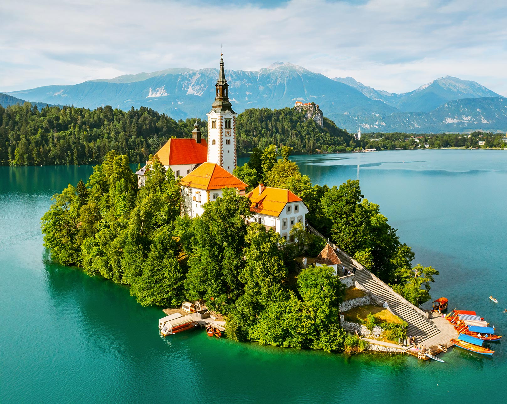 Beautiful Lake Bled with its iconic island church and Alpine mountain views in Slovenia.