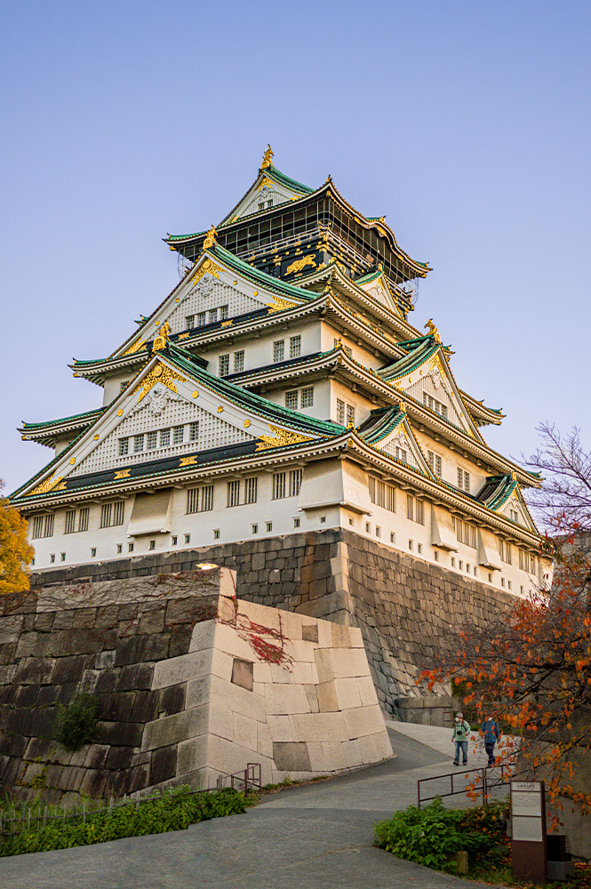 Historic Osaka Castle surrounded by beautiful gardens in Japan.
