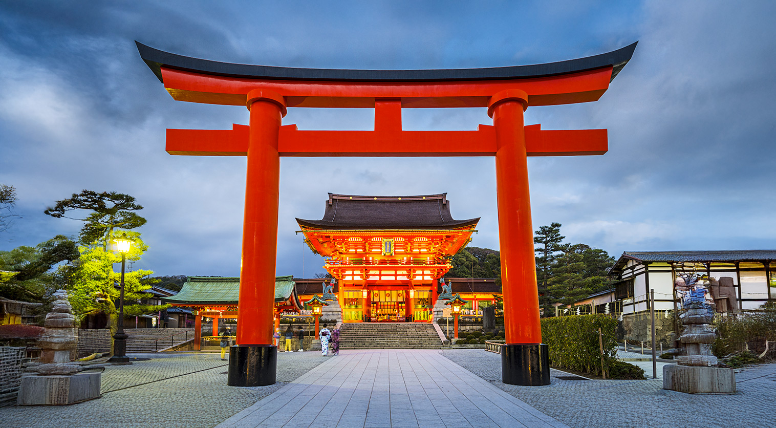 Iconic red torii gate at Fushimi Inari Shrine in Kyoto, Japan.