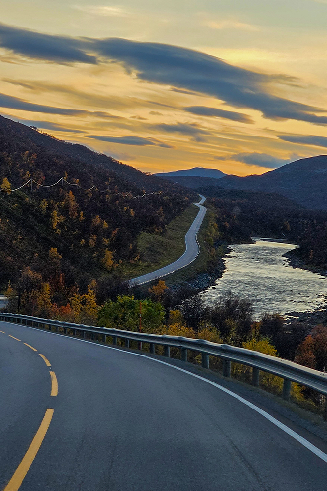 Panoramic mountain road winding through the breathtaking Scandinavian landscape.