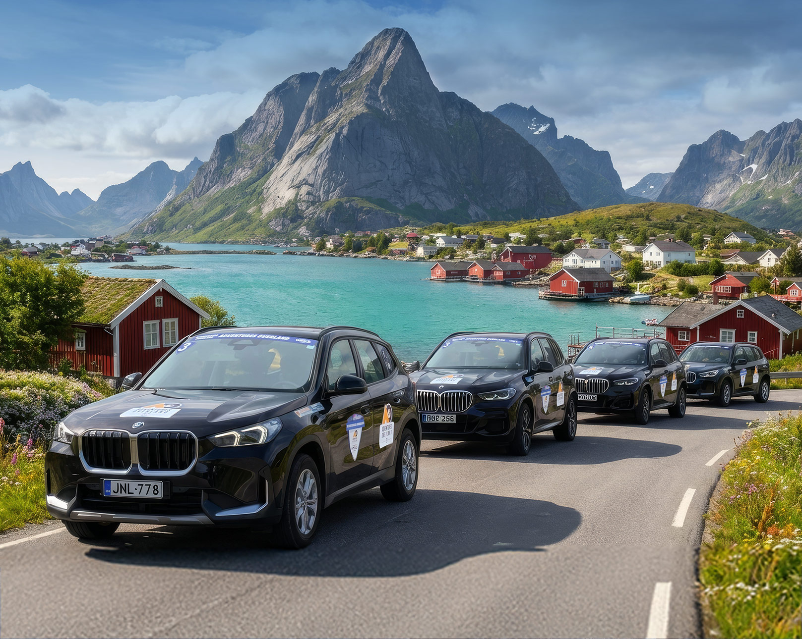 Luxury SUV convoy driving through the scenic fjords and mountains of Scandinavia.