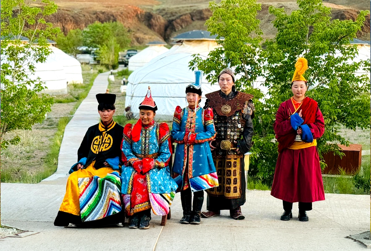 Traditional Mongolian performers in colorful cultural attire.