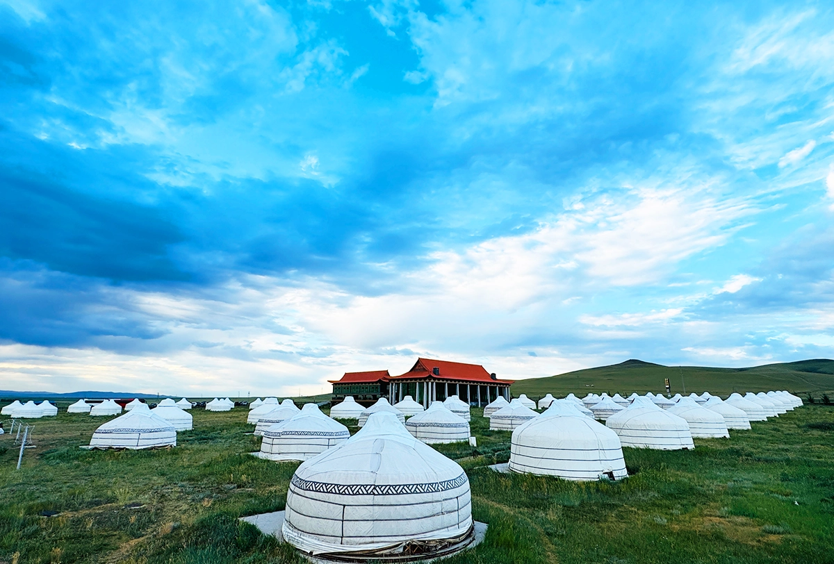 Traditional Mongolian ger camp on the open steppe.