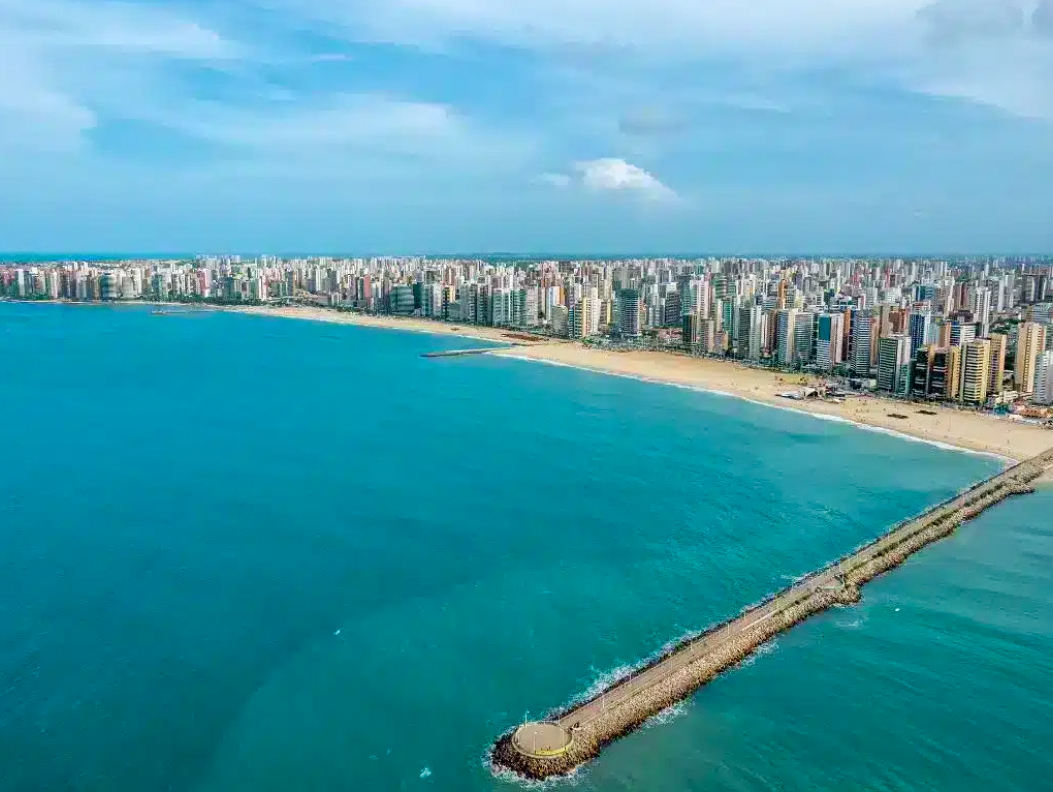 The palm-lined beaches and breakwater of sun-kissed Fortaleza